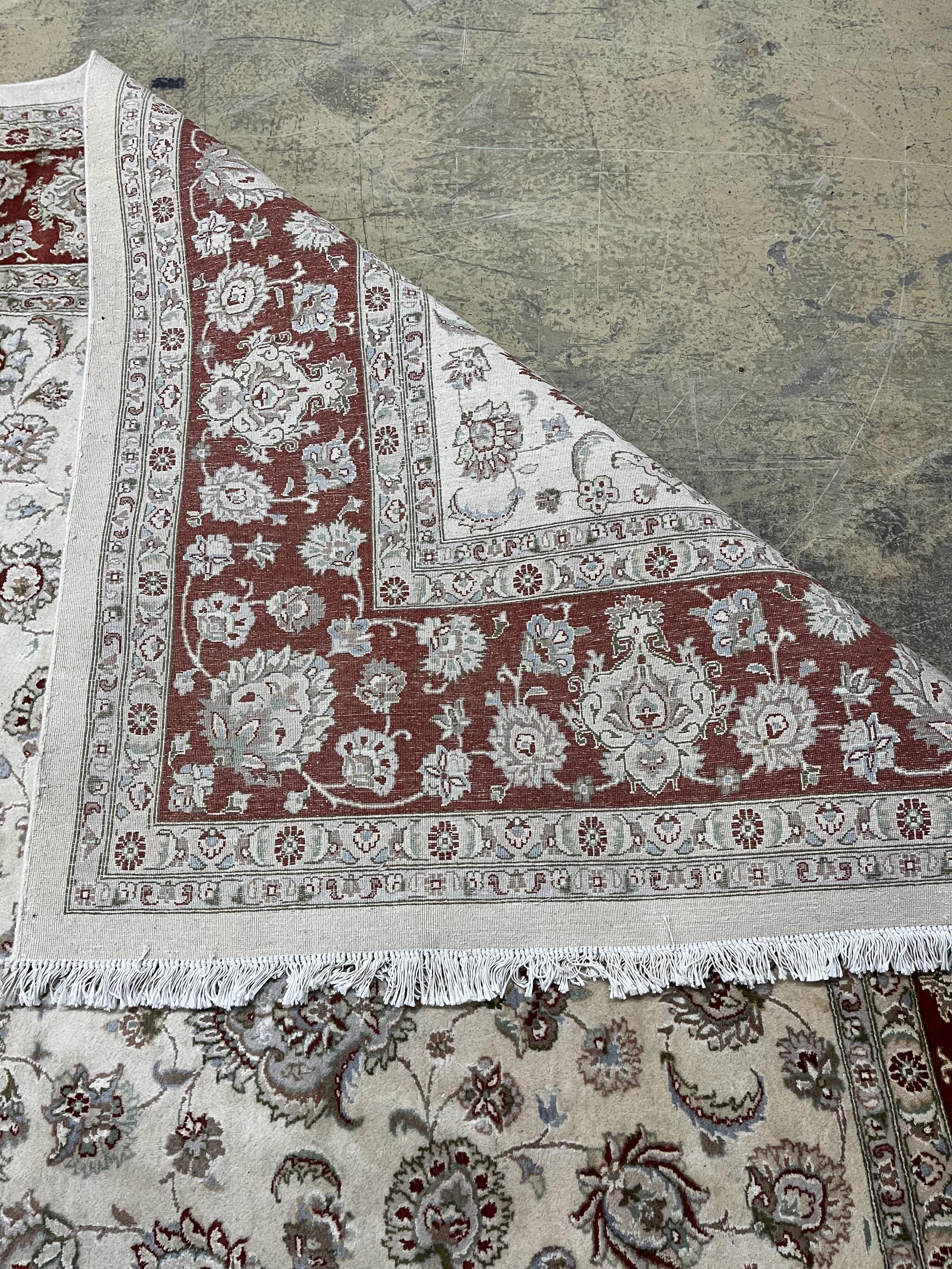 A Ziegler style ivory ground carpet, 320 x 274cm. Condition - fair to good